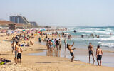 Illustrative: Israelis enjoy the beach in Bat Yam, June 29, 2024. (Yossi Aloni/Flash90)