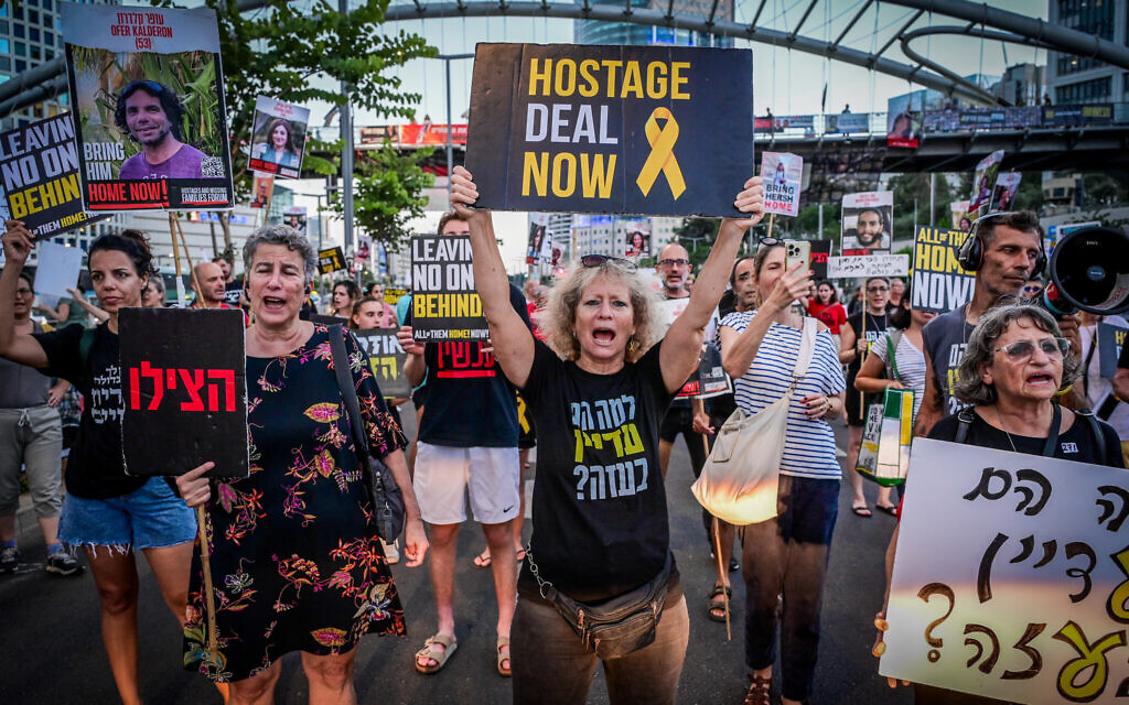 Demonstrators call for the release of Israeli hostages held in the Gaza Strip, outside Hakirya Base in Tel Aviv, July 3, 2024 (Avshalom Sassoni/Flash90)