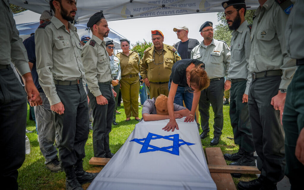 Family and friends attend the funeral of Cpt. Elay Elisha Lugasi who was killed at a battle in the Gaza Strip, in Kiryat Shmona, July 4, 2024 (Ayal Margolin/Flash90)