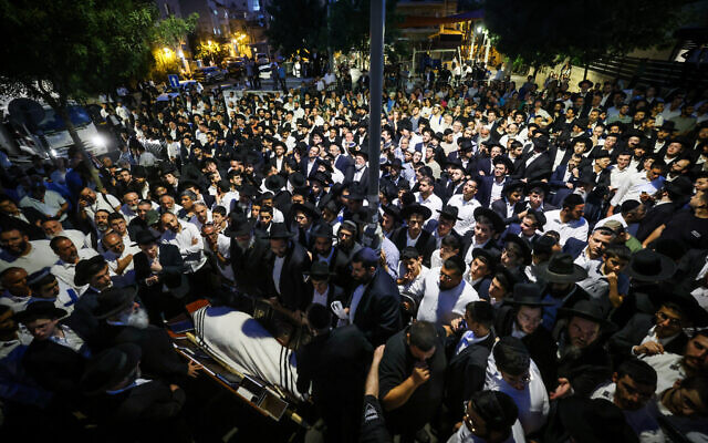 Mourners attend the funeral of Rabbi Yehuda Deri, the chief rabbi of Beersheba, in Jerusalem on July 9, 2024. (Chaim Goldberg/Flash90) Mourners attend the funeral of Rabbi Yehuda Deri, the chief rabbi of Beersheba, in Jerusalem on July 9, 2024. (Chaim Goldberg/Flash90)