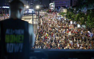 Demonstrators protest against Prime Minister Benjamin Netanyahu, the current Israeli government and for the release of hostages held in the Gaza Strip outside the Kirya Base in Tel Aviv, July 20, 2024. (Itai Ron/Flash90) Demonstrators protest against Prime Minister Benjamin Netanyahu, the current Israeli government and for the release of hostages held in the Gaza Strip outside the Kirya Base in Tel Aviv, July 20, 2024. (Itai Ron/Flash90)