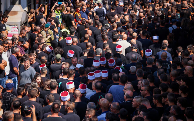 Thousands gather for the funerals of children killed by a Hezbollah rocket attack on Majdal Shams, in the Golan Heights, July 28, 2024 (David Cohen/Flash90) Thousands gather for the funerals of children killed by a Hezbollah rocket attack on Majdal Shams, in the Golan Heights, July 28, 2024 (David Cohen/Flash90)