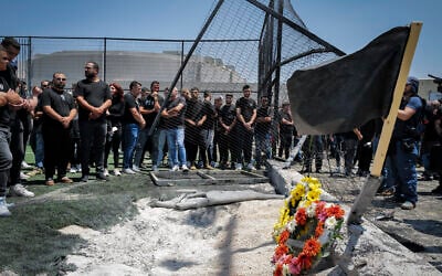 People at the scene of a Hezbollah missile attack that killed 12 children at a soccer field in the Druze village of Majdal Shams the previous day, in the Golan Heights, July 28, 2024. (Michael Giladi/Flash90)