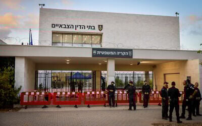 Police guard a military court at the Beit Lid base in central Israel, amid a protest against the detention of Israeli reserve soldiers suspected of abusing a Palestinian detainee, July 30, 2024. (Chaim Goldberg/Flash90)
