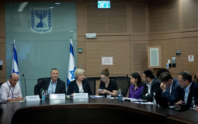 Defense and Foreign Affairs Committee Chairman Yuli Edelstein (second from left) leads a committee meeting on the ultra-Orthodox enlistment law at the Knesset in Jerusalem, July 31, 2024. (Yonatan Sindel/Flash90) Defense and Foreign Affairs Committee Chairman Yuli Edelstein (second from left) leads a committee meeting on the ultra-Orthodox enlistment law at the Knesset in Jerusalem, July 31, 2024. (Yonatan Sindel/Flash90)