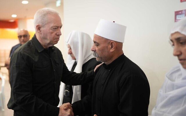 Defense Minister Yoav Gallants visits bereaved families in the northern Druze village of Majdal Shams after 12 children were killed in a Hezbollah rocket attack on the weekend, July 29, 2024. (Elad Malcha/Defense Ministry) Defense Minister Yoav Gallants visits bereaved families in the northern Druze village of Majdal Shams after 12 children were killed in a Hezbollah rocket attack on the weekend, July 29, 2024. (Elad Malcha/Defense Ministry)