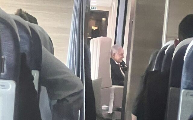 File: Prime Minister Benjamin Netanyahu is seen by journalists aboard the official Wing of Zion plane during its flight to Washington, DC, on July 22, 2024. (Lazar Berman/ Times of Israel)
