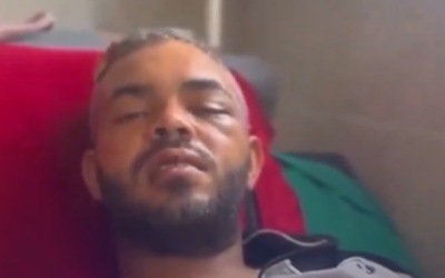 Gazan anti-Hamas activist Amin Abed speaks from a hospital bed in northern Gaza after sustaining critical injury in an attack by masked assailants whom he identified with the terror group's internal security service, in a video published by Saudi state-owned Al-Arabiya news site on July 9, 2024. (Screen capture: X/Al-Arabiya, used in accordance with Clause 27a of the Copyright Law)