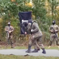 Members of the neo-Nazi group "The Base" are seen training in an undated propaganda video. (Youtube screenshot)