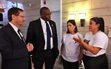 President Isaac Herzog and UK  Foreign Secretary David Lammy speak with the family of a hostage, in Jerusalem, on July 15, 2024. ((Haim Zach/GPO)