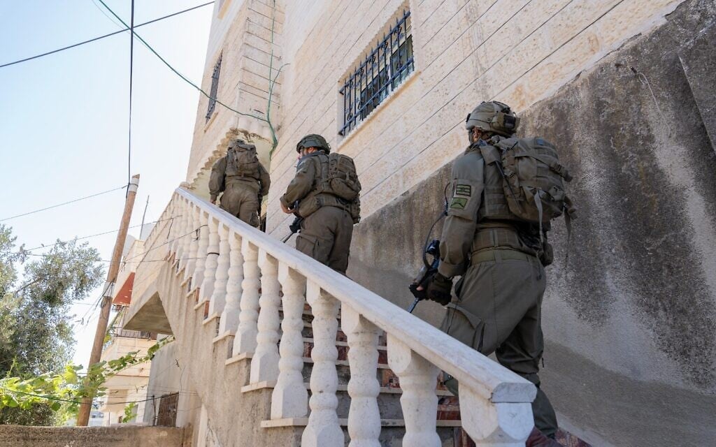 IDF troops carry out searches for a Palestinian terrorist who seriously wounded an Israeli man in the southern West Bank, July 31, 2024. (Israel Defense Forces)
