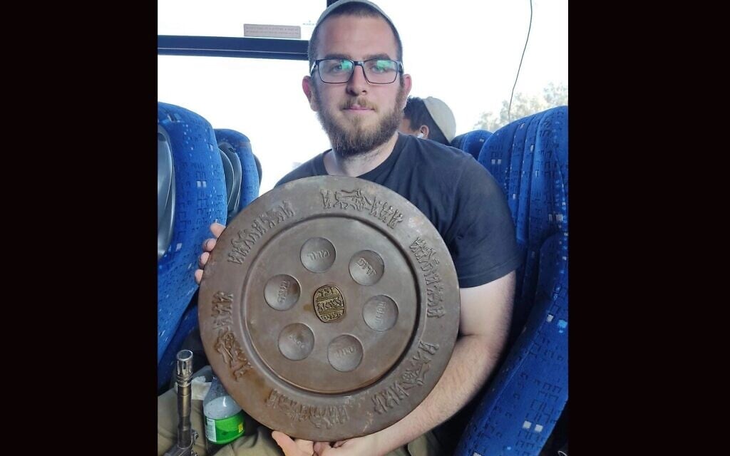 Or, a solider fighting in Gaza, displays a seder plate he found in the territory. (Courtesy via JTA) Or, a solider fighting in Gaza, displays a seder plate he found in the territory. (Courtesy via JTA)