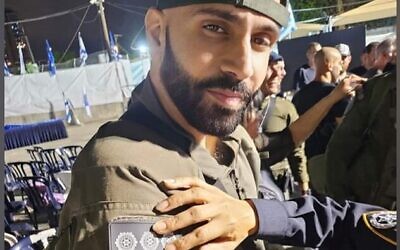 Rapper Yoav Eliasi "The Shadow" shows his "inspector" insignia, July 15, 2024. (via Facebook)