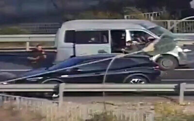 A grey Volkswagen that carried seven Gazan laborers and their Israeli Bedouin driver, surrounded by Hamas terrorists at Sha'ar Hanegev Junction, on October 7, 2023. (X video screenshot: used in accordance with Clause 27a of the Copyright Law)