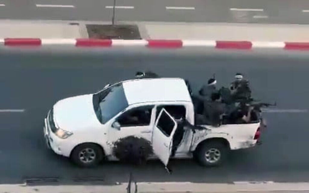 Armed terrorists in Sderot, southern Israel, having infiltrated from Gaza, on the morning of October 7, 2023 (X screenshot; used in accordance with Clause 27a of the Copyright Law)