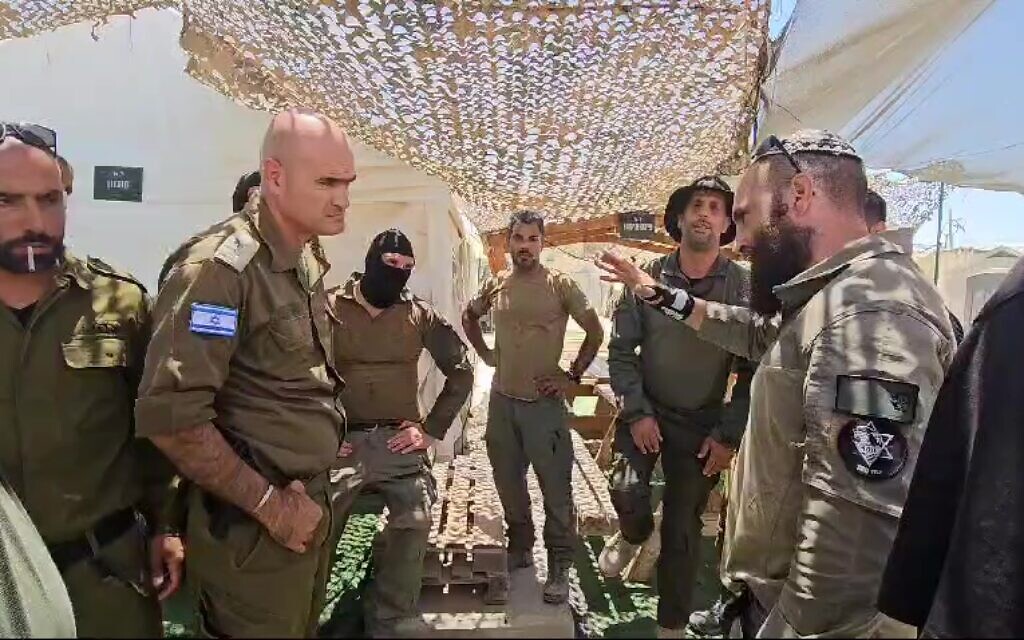 A heated argument erupts between soldiers at the Sde Teiman detention facility in southern Israel after Military Police investigators arrived to detain suspects for questioning, July 29, 2024. (Screenshot: X, used in accordance with Clause 27a of the Copyright Law)