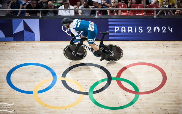 Israeli cyclist Mikhail Yakovlev races in the men's sprint at the 2024 Paris Olympics on August 7, 2024. (Olympic Committee of Israel) Israeli cyclist Mikhail Yakovlev races in the men's sprint at the 2024 Paris Olympics on August 7, 2024. (Olympic Committee of Israel)