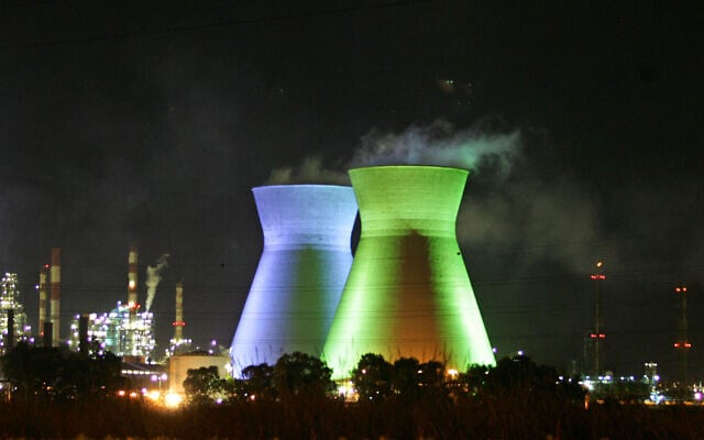 The cooling towers of the Haifa Oil Refineries are seen lit by green and blue lights as night falls over the northern port city after another day of rocket attacks fired by Hezbollah terrorists from south Lebanon, July 24, 2006. (Gali Tibbon / AFP) The cooling towers of the Haifa Oil Refineries are seen lit by green and blue lights as night falls over the northern port city after another day of rocket attacks fired by Hezbollah terrorists from south Lebanon, July 24, 2006. (Gali Tibbon / AFP)