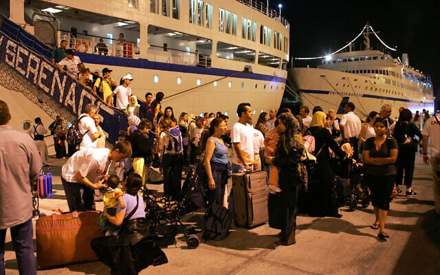 Evacuees from war-torn Lebanon disembark from the Serenade cruise liner at Larnaca port in Cyprus early July 27, 2006. (Samuel Aranda/AFP) Evacuees from war-torn Lebanon disembark from the Serenade cruise liner at Larnaca port in Cyprus early July 27, 2006. (Samuel Aranda/AFP)
