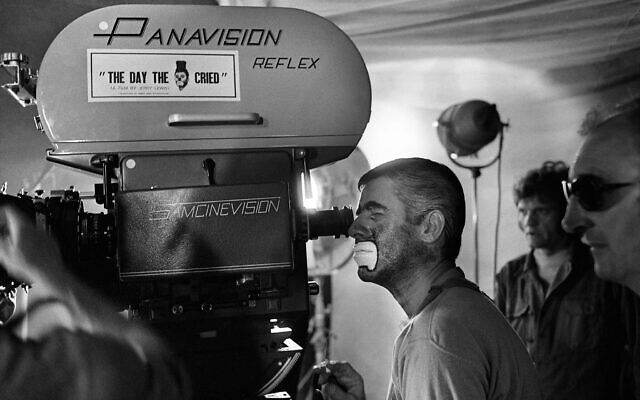 Jerry Lewis looks through the camera during filming of 'The Day the Clown Cried,' on March 20, 1972, Paris, France. (AP Photo/Jean Jacques Levy)