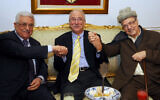 (L-R) PA President Mahmoud Abbas, Tunisian Foreign Affairs Minister Mouldi Kefi, and Fatah's ex-Secretary General Farouk Kaddumi hold hands shortly after the Abbas's arrival in Tunis, Tunisia, November 10, 2011. (Fethi Belaid/AFP)