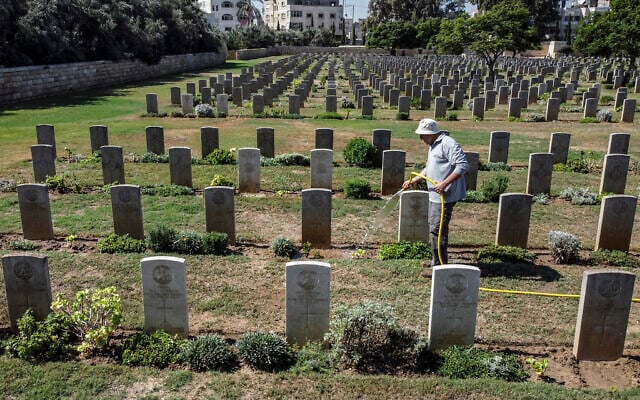 A gardener waters the lawn between the tombstones at the Commonwealth Gaza War Cemetery, commonly known as the British War Cemetery and in which are interred the remains of 3217 Allied soldiers who died during World War I, in Gaza City on September 28, 2022. (Mahmud Hams/AFP) A gardener waters the lawn between the tombstones at the Commonwealth Gaza War Cemetery, commonly known as the British War Cemetery and in which are interred the remains of 3217 Allied soldiers who died during World War I, in Gaza City on September 28, 2022. (Mahmud Hams/AFP)