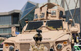 A member of Saudi Arabia's special forces stands in front of a military vehicle during the 'World Defense Show 2024,' north of the Saudi capital of Riyadh, February 4, 2024. (Fayez Nureldine / AFP)