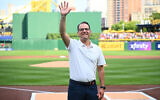 Pennsylvania Governor Josh Shapiro waves to the crowd before the game between the Philadelphia Phillies and the Pittsburgh Pirates at PNC Park on July 20, 2024, in Pittsburgh, Pennsylvania.   (Justin Berl/Getty Images/AFP)