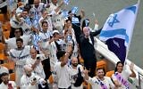 Illustrative: The Israeli delegation's flag bearers Peter Paltchik (2R) and Andrea Murez (R) stand at the front of the team's boat during the opening ceremony of the Paris 2024 Olympic Games on the Seine river in Paris, France, July 26, 2024. (Damien Meyer / AFP)