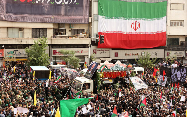 Iranians take part in a funeral ceremony for Hamas chief Ismail Haniyeh, in Tehran, on August 1, 2024 (AFP)