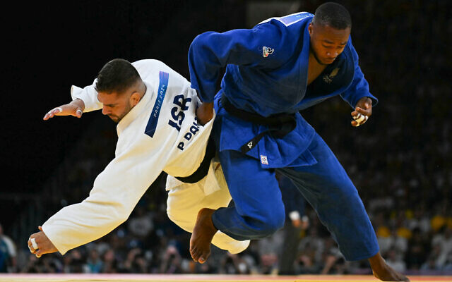 Israel's Peter Paltchik and France's Aurelien Diesse (blue) compete in the judo men's -100kg round of 16 bout of the Paris 2024 Olympic Games at the Champ-de-Mars Arena, in Paris on August 1, 2024. (Luis ROBAYO / AFP) Israel's Peter Paltchik and France's Aurelien Diesse (blue) compete in the judo men's -100kg round of 16 bout of the Paris 2024 Olympic Games at the Champ-de-Mars Arena, in Paris on August 1, 2024. (Luis ROBAYO / AFP)