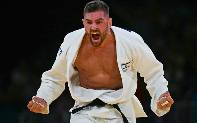 Israel's Peter Paltchik reacts after beating Netherlands' Michael Korrel in the judo men's -100kg repechage bout of the Paris 2024 Olympic Games, August 1, 2024. (Luis Robayo/AFP) Israel's Peter Paltchik reacts after beating Netherlands' Michael Korrel in the judo men's -100kg repechage bout of the Paris 2024 Olympic Games, August 1, 2024. (Luis Robayo/AFP)