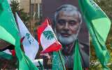 A portrait of slain Hamas leader Ismail Haniyeh is displayed during a demonstration denouncing his killing and that of Hezbollah's senior commander Fuad Shukr, in the Lebanese coastal city of Sidon, on August 2, 2024. (Mahmoud Zayyat / AFP)