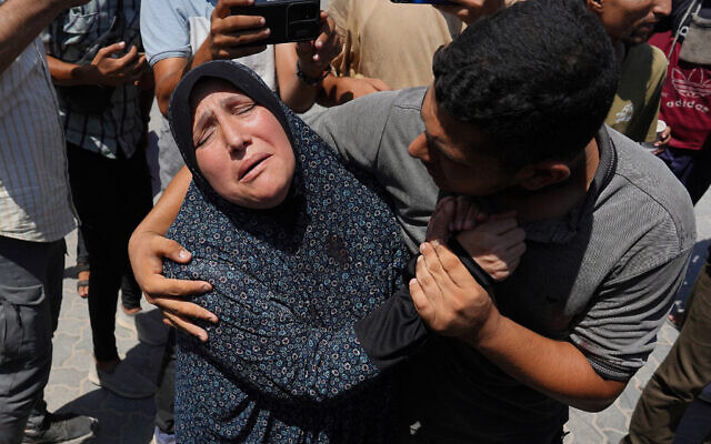 A woman in comforted outside Nasser hospital in Khan Yunis following an Israeli strike in the southern Gaza Strip on August 7, 2024 (Photo by Bashar TALEB / AFP) A woman in comforted outside Nasser hospital in Khan Yunis following an Israeli strike in the southern Gaza Strip on August 7, 2024 (Photo by Bashar TALEB / AFP)