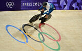Israel's Mikhail Yakovlev competes in a men's track cycling sprint qualifying round of the Paris 2024 Olympic Games at the Saint-Quentin-en-Yvelines National Velodrome, August 7, 2024. (John MACDOUGALL / AFP)