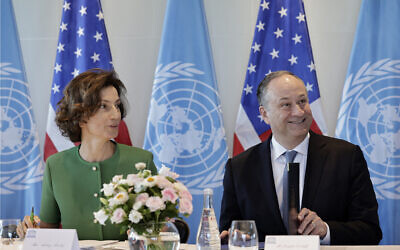UNESCO Director-General Audrey Azoulay (L) and US Second Gentleman Doug Emhoff attend a meeting dedicated to combating antisemitism through education, at the UNESCO headquarters in Paris on August 8, 2024. (STEPHANE DE SAKUTIN / AFP)