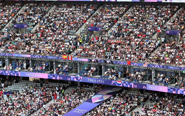 Spectators attend the closing ceremony of the Paris 2024 Olympic Games at the Stade de France, in Saint-Denis, in the outskirts of Paris, on August 11, 2024. (MOHD RASFAN / AFP) Spectators attend the closing ceremony of the Paris 2024 Olympic Games at the Stade de France, in Saint-Denis, in the outskirts of Paris, on August 11, 2024. (MOHD RASFAN / AFP)