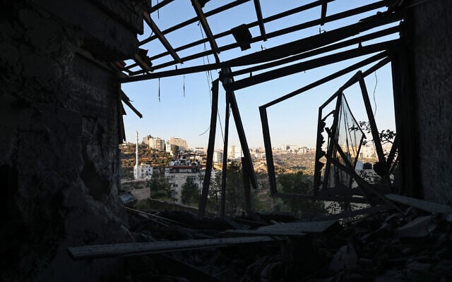 The damage after Israeli forces demolished a house in Ramallah in the West Bank on August 13, 2024, which belongs to Palestinian Aysar Barghouti, accused of taking part in a deadly shooting attack north of the Palestinian city in January and subsequently detained. (Photo by Zain JAAFAR / AFP) The damage after Israeli forces demolished a house in Ramallah in the West Bank on August 13, 2024, which belongs to Palestinian Aysar Barghouti, accused of taking part in a deadly shooting attack north of the Palestinian city in January and subsequently detained. (Photo by Zain JAAFAR / AFP)