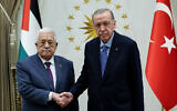This handout photograph taken and released by the Turkish Presidential Press Service on August 14, 2024, shows Turkish President Recep Tayyip Erdogan (R) shaking hands with Palestinian Authority President Mahmoud Abbas (L) during an official ceremony at the Presidential Complex in Ankara. (Turkish Presidential Press Service/AFP)