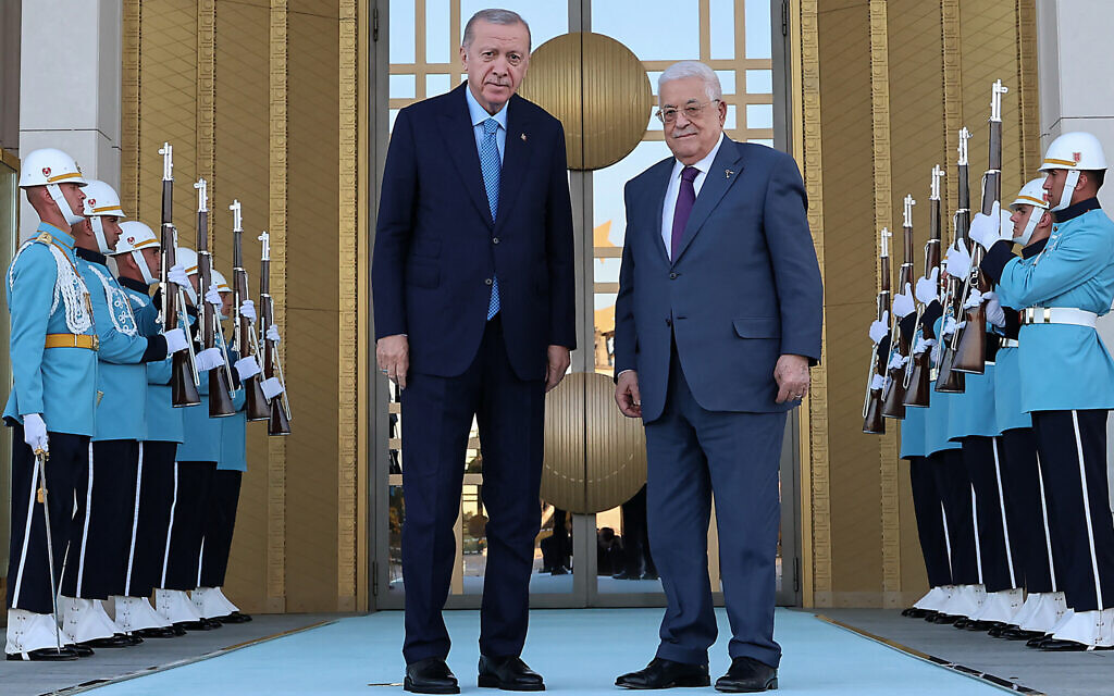 This handout photograph taken and released by the Turkish Presidential Press Service on August 14, 2024, shows Turkish President Recep Tayyip Erdogan, left, posing with Palestinian Authority President Mahmoud Abbas during an official ceremony at the Presidential Complex in Ankara. (Turkish Presidental Press Service / TURKISH PRESIDENTIAL PRESS SERVICE / AFP)