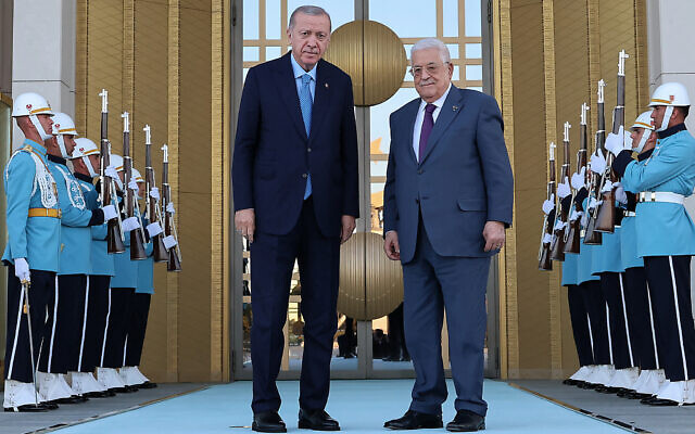 This handout photograph taken and released by the Turkish Presidential Press Service on August 14, 2024, shows Turkish President Recep Tayyip Erdogan, left, posing with Palestinian Authority President Mahmoud Abbas during an official ceremony at the Presidential Complex in Ankara. (Turkish Presidental Press Service / TURKISH PRESIDENTIAL PRESS SERVICE / AFP)