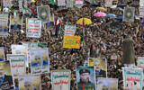 Yemenis lift placards and flags and hold portraits of newly appointed Hamas leader Yahya Sinwar, and assassinated terror chiefs Fuad Shukr and Ismail Haniyeh, during a rally in the Houthi-controlled capital Sanaa in solidarity with Palestinians on August 16, 2024, amid the war in the Gaza Strip between Israel and the Hamas terror group. (AFP)