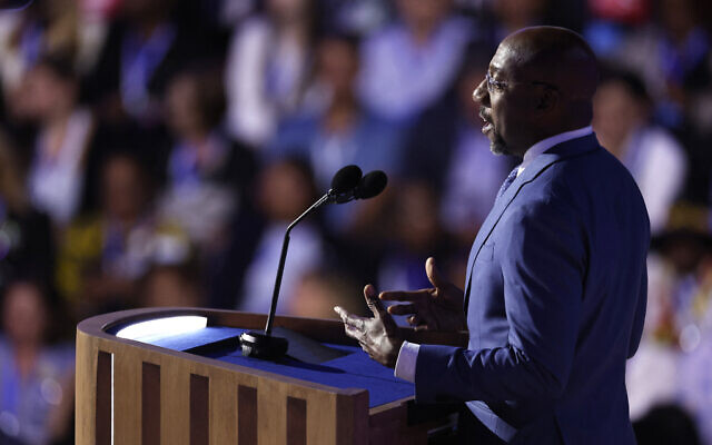 US Senator Raphael Warnock of Georgia speaks on the first day of the Democratic National Convention at the United Center in Chicago, on August 19, 2024. (Kamil Krzaczynski/AFP) US Senator Raphael Warnock of Georgia speaks on the first day of the Democratic National Convention at the United Center in Chicago, on August 19, 2024. (Kamil Krzaczynski/AFP)