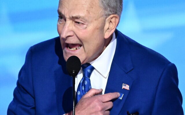 US Senate Majority Leader Chuck Schumer points to a "Foundation to Combat Antisemitism" pin on his lapel as he speaks on the second day of the Democratic National Convention at the United Center in Chicago, on August 20, 2024. (Mandel Ngan/AFP) US Senate Majority Leader Chuck Schumer points to a "Foundation to Combat Antisemitism" pin on his lapel as he speaks on the second day of the Democratic National Convention at the United Center in Chicago, on August 20, 2024. (Mandel Ngan/AFP)