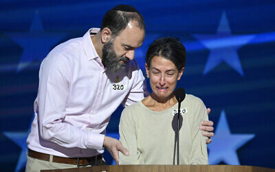 Jon Polin (left) comforts his wife Rachel Goldberg as she speaks about their son Hersh Goldberg-Polin, who is being held hostage by Hamas, on the third day of the Democratic National Convention (DNC) at the United Center in Chicago, Illinois, on August 21, 2024. (Mandel Ngan / AFP) Jon Polin (left) comforts his wife Rachel Goldberg as she speaks about their son Hersh Goldberg-Polin, who is being held hostage by Hamas, on the third day of the Democratic National Convention (DNC) at the United Center in Chicago, Illinois, on August 21, 2024. (Mandel Ngan / AFP)