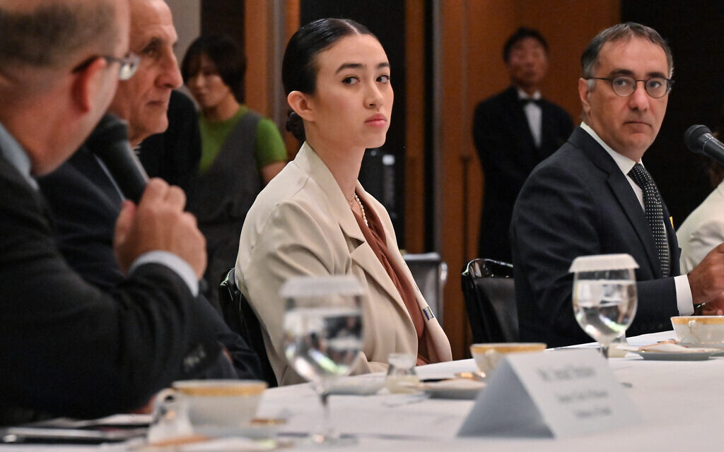 Rescued hostage Noa Argamani, center, who was abducted with hundreds of others from the Supernova music festival during Hamas's October 7 terror onslaught, attends a meeting with G7 embassy representatives during a visit to Tokyo, Japan on August 21, 2024. (Photo by Richard A. Brooks / AFP)