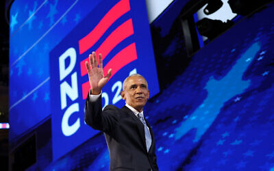 Former US president Barack Obama gestures as he walks off stage after speaking on the second day of the Democratic National Convention (DNC) at the United Center in Chicago, Illinois, on August 20, 2024. (CHARLY TRIBALLEAU / AFP)