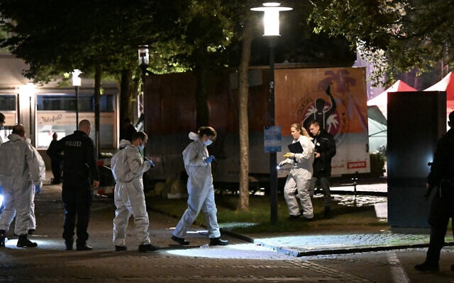 Forensic police use torch lights on August 24, 2024 to inspect the scene where at least three people were killed and several injured when a man attacked them with a knife on late August 23, 2024 in Solingen, western Germany (INA FASSBENDER / AFP)