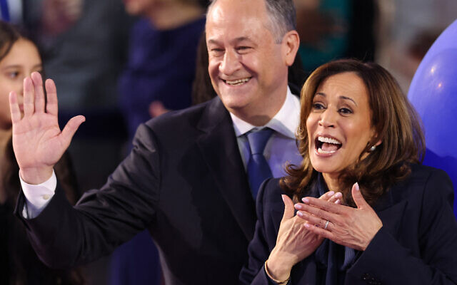 US Vice President and 2024 Democratic presidential candidate Kamala Harris and her husband US Second Gentleman Douglas Emhoff wave from the stage on the fourth and last day of the Democratic National Convention (DNC) at the United Center in Chicago, Illinois, on August 22, 2024. (Charly Triballeau / AFP) US Vice President and 2024 Democratic presidential candidate Kamala Harris and her husband US Second Gentleman Douglas Emhoff wave from the stage on the fourth and last day of the Democratic National Convention (DNC) at the United Center in Chicago, Illinois, on August 22, 2024. (Charly Triballeau / AFP)