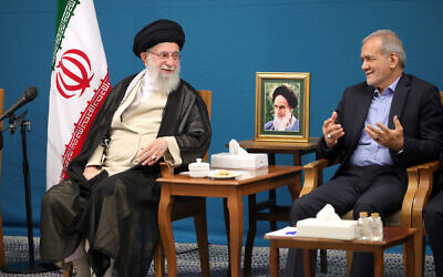 Iran's Supreme Leader Ayatollah Ali Khamenei, left, meets with Iranian President Masoud Pezeshkian in Tehran, Iran, August 27, 2024. Between them is a portrait of the Islamic Republic's founder, Ayatollah Ruhollah Khomeini. (KHAMENEI.IR/AFP)